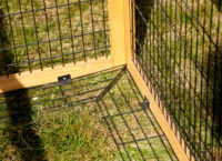 Open-air enclosure with breakout barrier