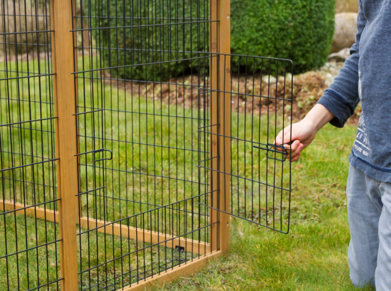 Outdoor pen with breakout barrier